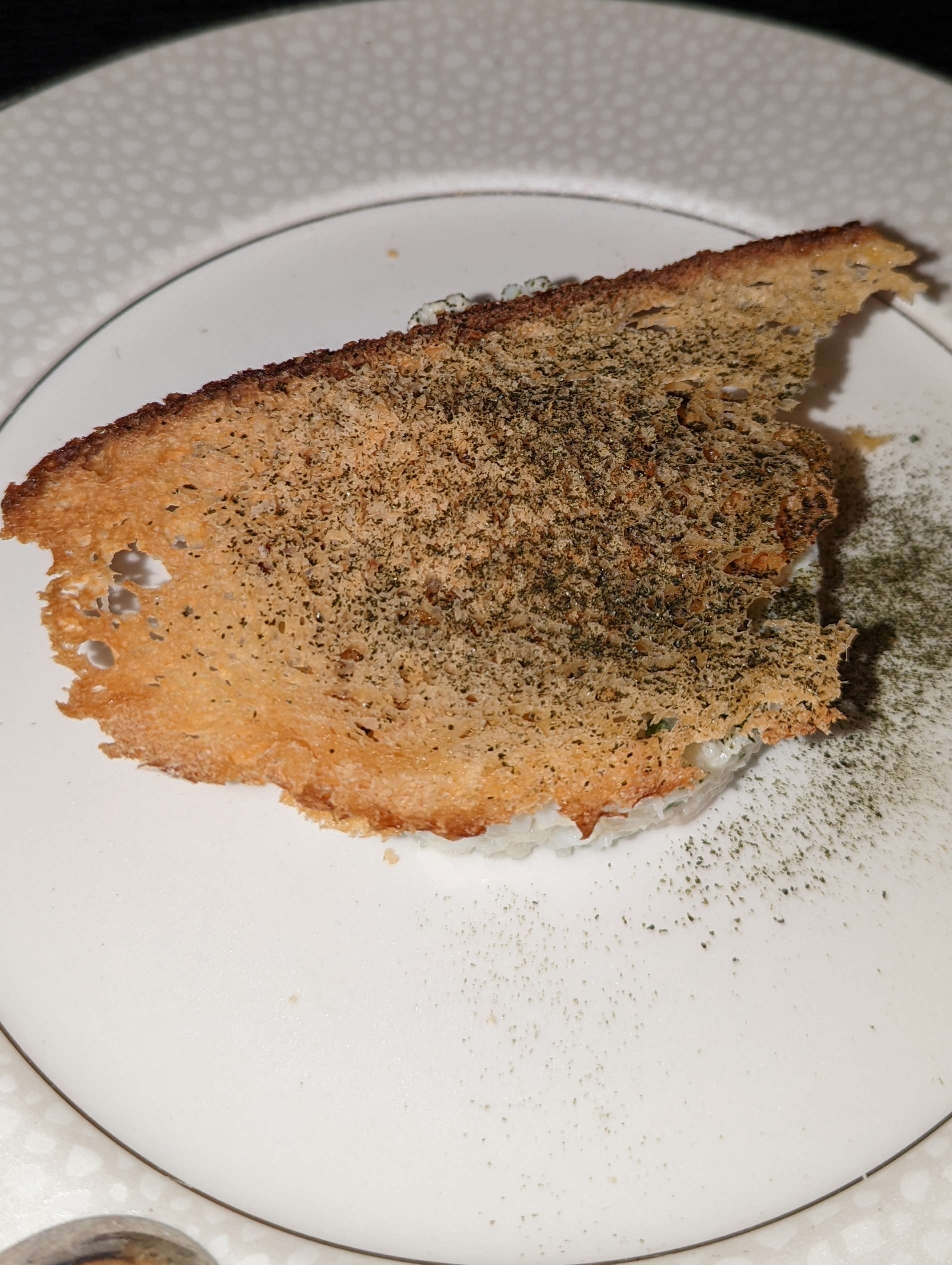 A thin, crispy piece of bread with creamy crab mix underneath. Taken during an evening at Nineteen at The Star.
